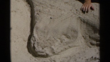 1954: friends sculpting sand at the beach NEW YORK