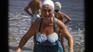 1954: old lady enjoying at beach NEW YORK