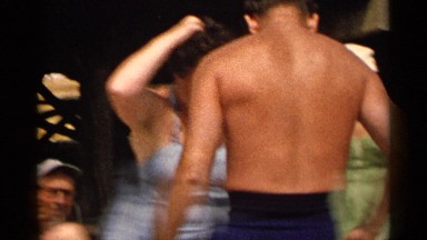 1954: the couple are dancing near the beach side with their family members