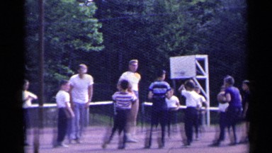 1954: kids are playing with brown balls on the tennis court NEW YORK