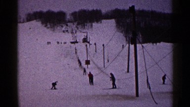 1960: people skiing down the mountains at a ski resort. DULUTH MINNESOTA