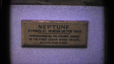 1960: a board that represent a landmark and a statue alone at the city