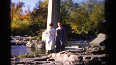1960: the beautiful couple walking on rocks and below the bridge SIOUX FALLS