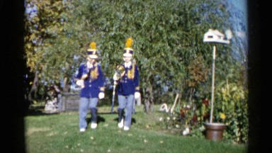 1960: two boys practicing marching band in their yard at home SIOUX FALLS SOUTH