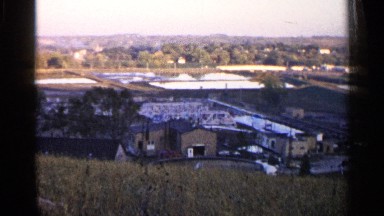 1960: a clear day overlooking a built up space in a rural area. SIOUX FALLS