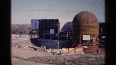 1960: an industry with some machines and the front of little open ground