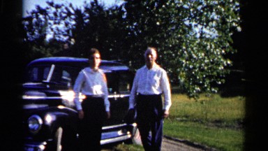 1961: two men stand beside a car on a beautiful sunny day DULUTH MINNESOTA