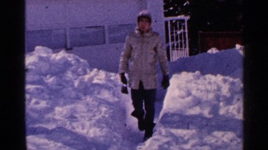 1965: a man walking on the snow and slipped little but balanced by himself