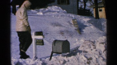 1965: a played at the snow time on winter holidays he sit the mail box
