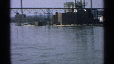 1965: a steel bridge over water and some water flowing right underneath