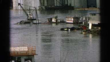 1965: houses and equipment in flood water. MINNESOTA