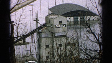 1965: snow blankets industrial area and flood waters surround buildings