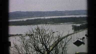 1965: the tops of poles and roofs are visible above a flooded plain MINNESOTA