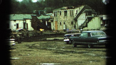 1965: aftermath of a burned down business or home, showing the remnants