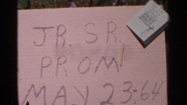 1964: special occasion for a prom with letters written on a sign for may 23rd