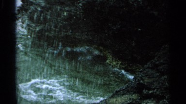 1964: waves crashing against rocks. WASHINGTON ISLAND WISCONSIN