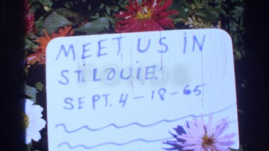 1965: a display board showing the notice to meet st. louis person