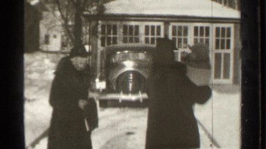 1939: two women with a child walk up a snowy driveway DANIELSON CONNECTICUT