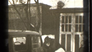 1939: people are in car rides at the roads then open car doors. DANIELSON