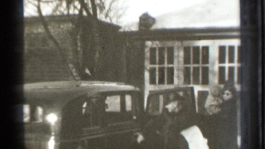 1939: a two ladies are open the car door and the lady carry the child