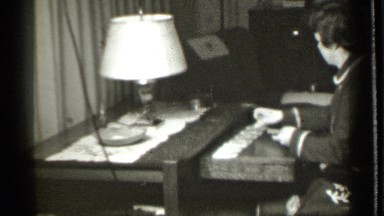 1939: Woman Holds Deck and Plays Solitaire at Table