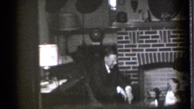1939: the two people are playing with a child happily