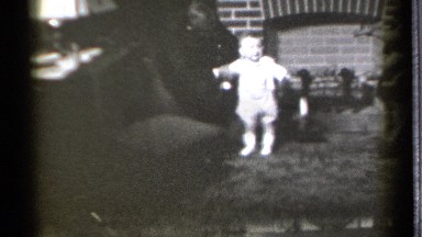1939: old home movie of parents with their baby teaching it to walk. DANIELSON