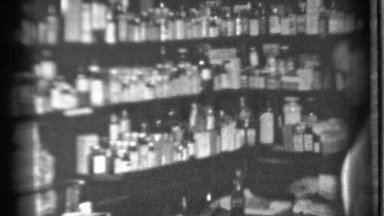 1939: a man check the our medical goods and clean the store arrange the goods