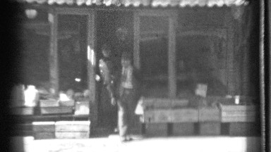 1939: man and policeman jokingly attack the other after leaving storefront