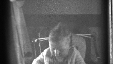 1939: a baby sitting in a chair and looking out a window DANIELSON CONNECTICUT