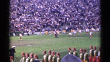 1944: football players warm up while the marching band marches by SAN FRANCISCO