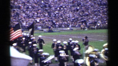 1944: marching band performing before a large stadium of people SAN FRANCISCO