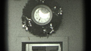 1944: the interior of an older home with decoration on the wall above a doorway.