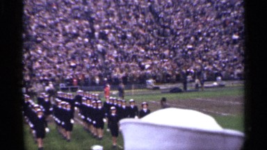 1944: parade peoples are walking with harmony and in uniform in middle of ground