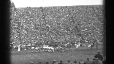 1944: football players running , sprinting, and tackling each other