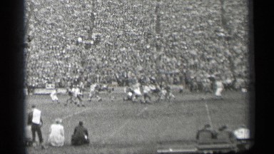 1944: rugby match going in a stadium where lot of people's witnessing it
