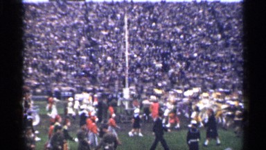 1944: lot of people gathering around a stadium