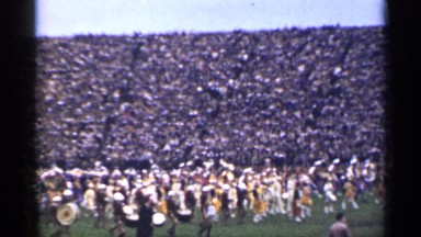 1944: there are many people marching on a large field performing in front