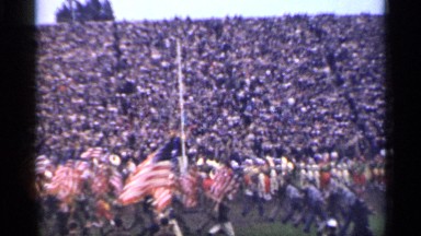 1944: a lot of people are doing parade with their national flags and more people