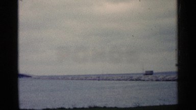 1960: A River Pond and Bridge with Vehicles in Michigan