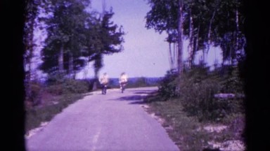 1960: people are cycling on the road MICHIGAN