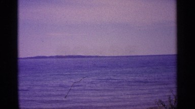 1960: calm tide waters rolling in. MICHIGAN