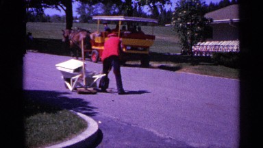 1960: a worker create for the road near to the one cow transport go to the other