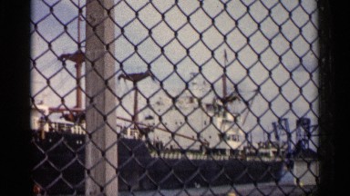 1960: huge ship, viewed through a fence MICHIGAN