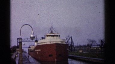 1960: many boats and ships are parked at the harbor at evening time MICHIGAN