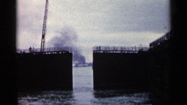 1960: Smoking Structure Framed by Closing Gates Limiting Ocean Access