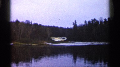 1960: tranquil morning at the lake, surrounded by trees