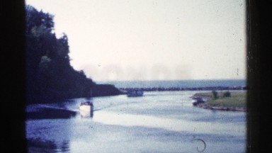 1960: the car are most travel in behind the sea side, vintage clip