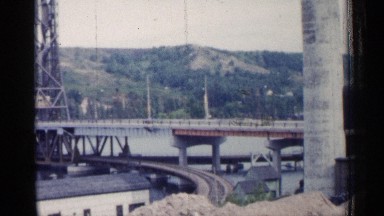 1960: part of bridge across a water body, road bridge above, rail below MICHIGAN