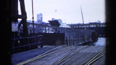 1960: bridge letting down at a dock area. MICHIGAN